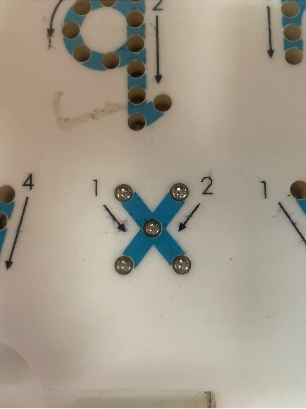 Magnetic ball board to teach/train proper letter formation